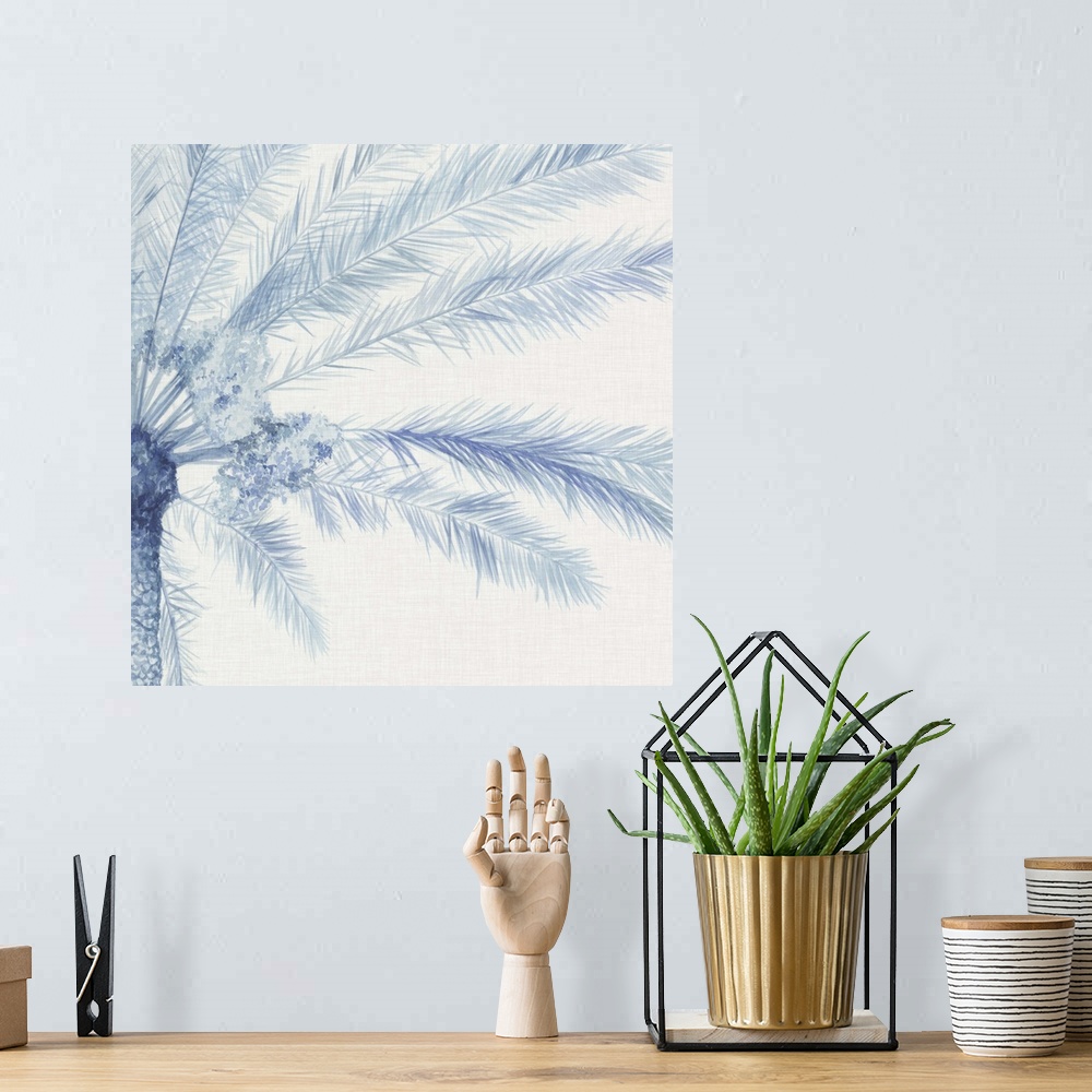 A bohemian room featuring A blue palm split between two panels against a white background.