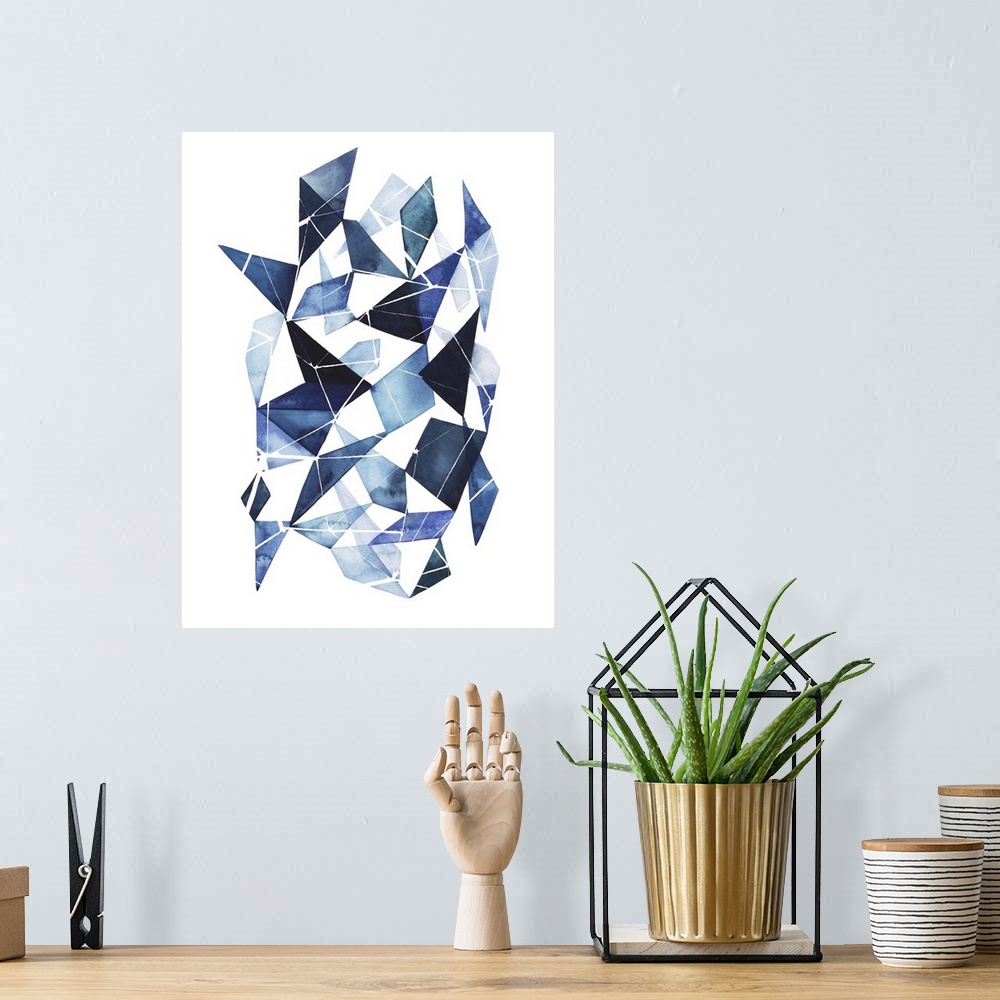 A bohemian room featuring Abstract watercolor geometric artwork in shades of blue.