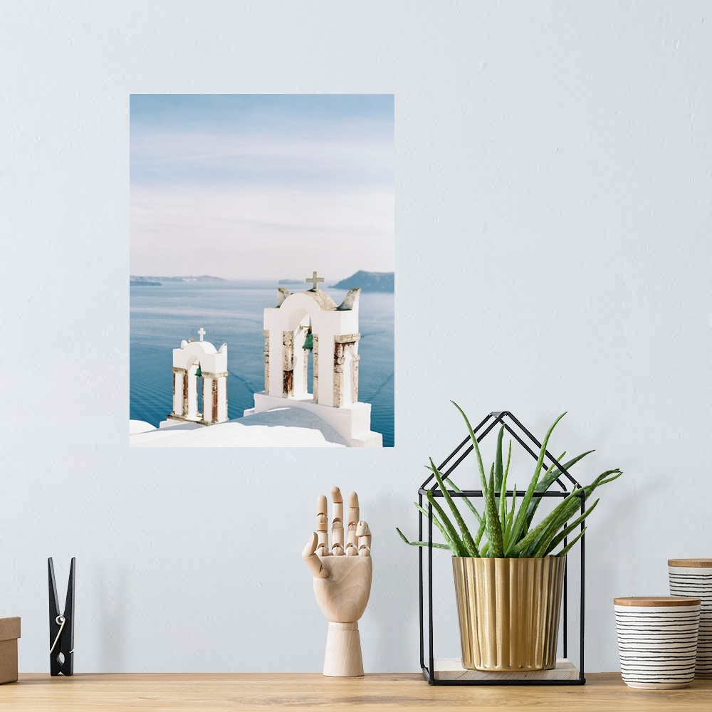 A bohemian room featuring Photograph of church bell towers overlooking the ocean in the Greek city of Oia, Santorini.