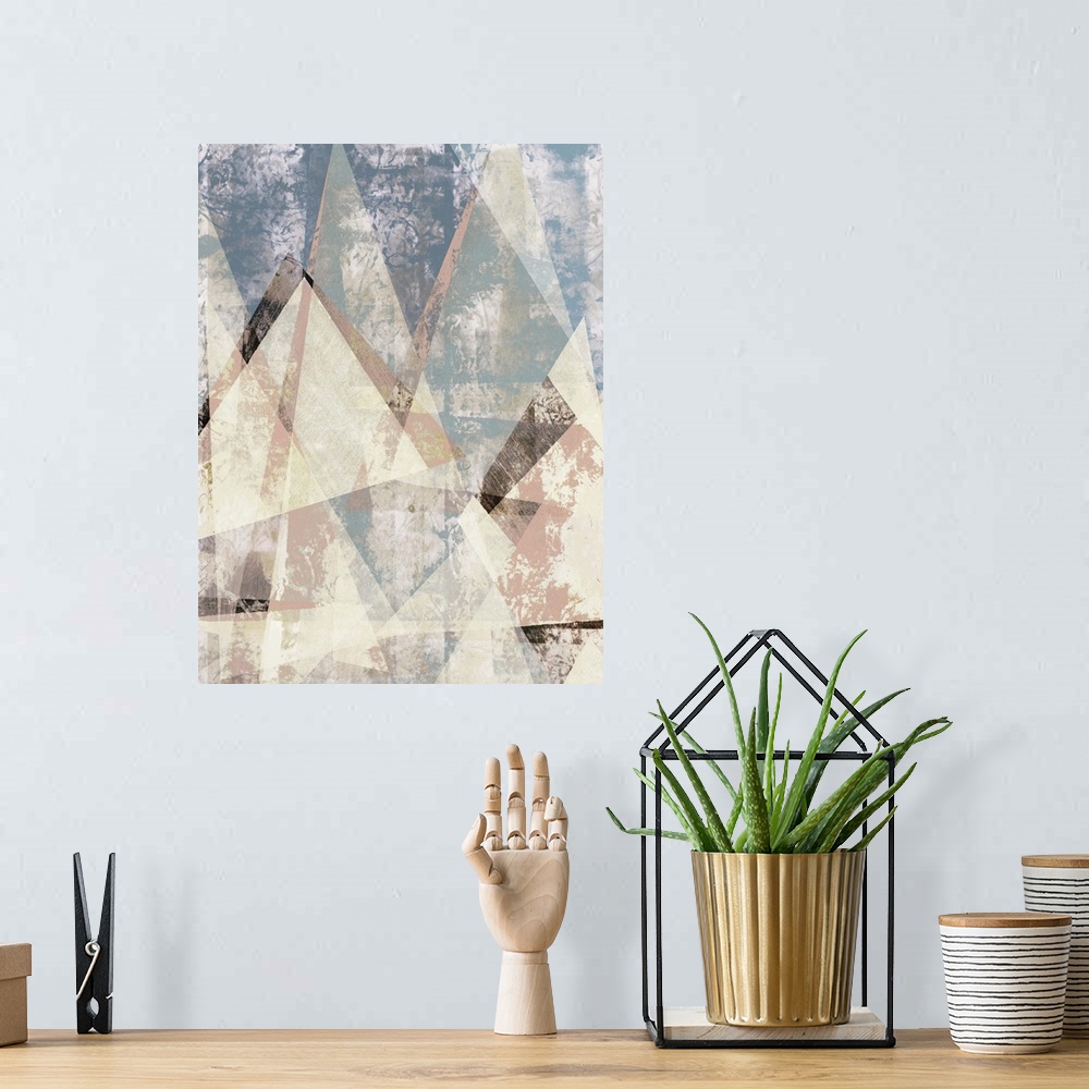 A bohemian room featuring Abstract artwork of triangular shapes with a weathered texture.