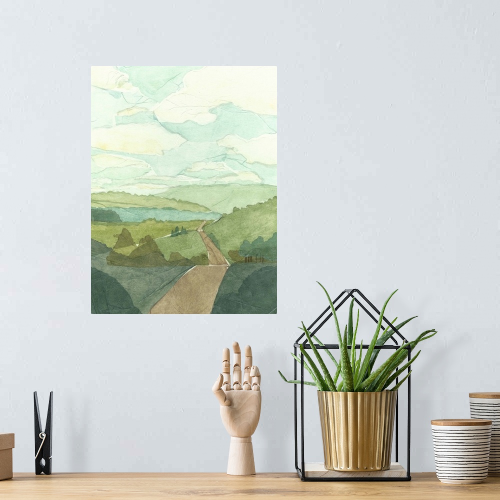 A bohemian room featuring Countryside landscape painting with a road crossing over rolling hills.