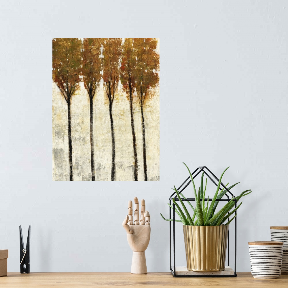 A bohemian room featuring Contemporary painting of five thin trees with fall leaves.
