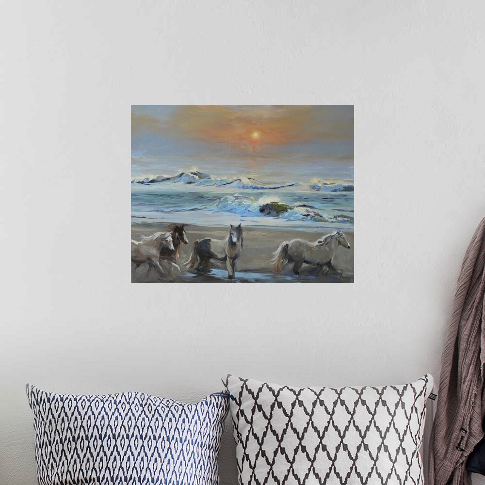 A bohemian room featuring Contemporary painting of a herd of wild horses on the coast at dawn.