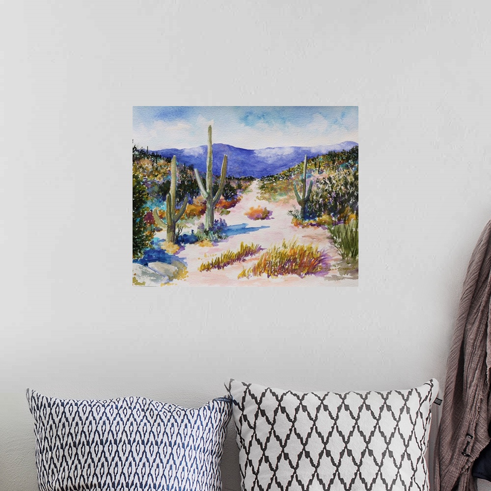A bohemian room featuring A beautiful watercolor painting of tall cactus in a lush desert landscape