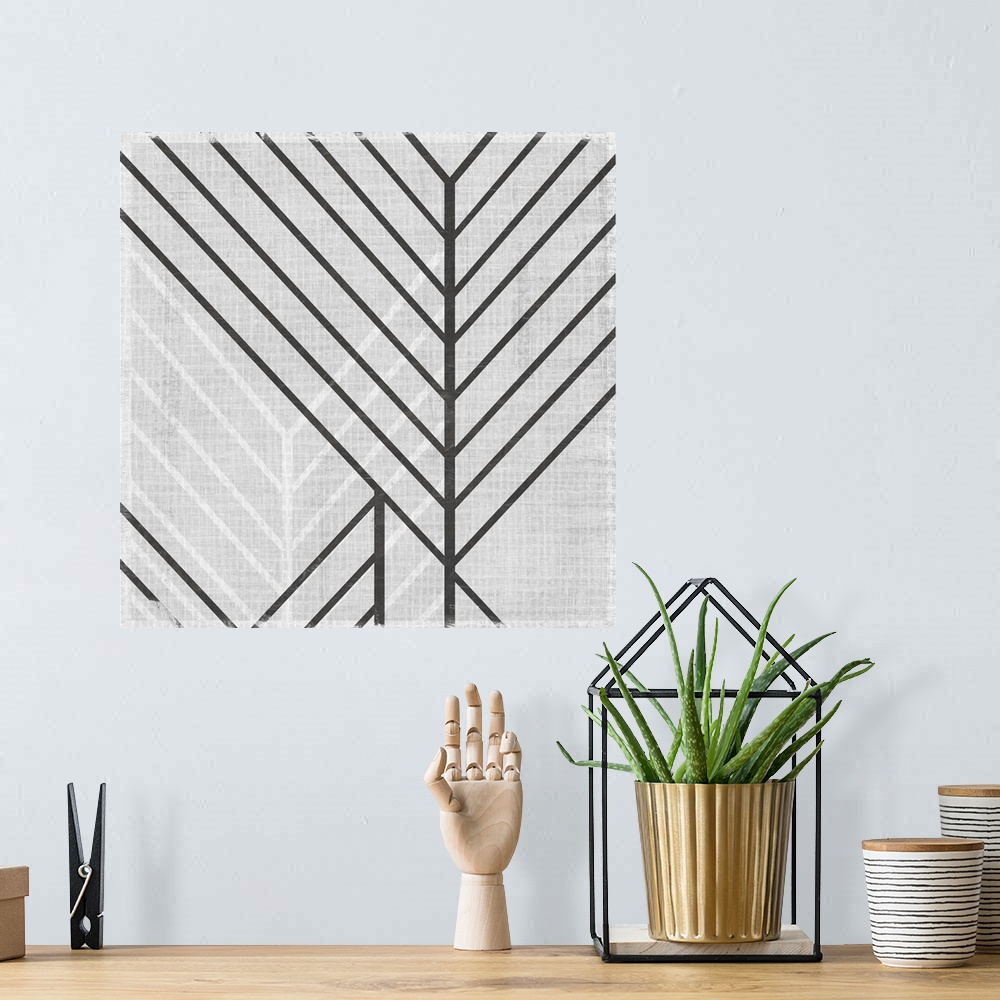 A bohemian room featuring Square abstract art with lines running diagonally across the canvas in gray and white.