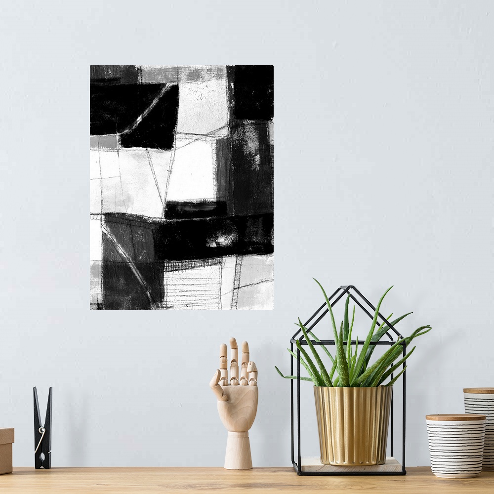 A bohemian room featuring Contemporary abstract painting made of white and black blocks.