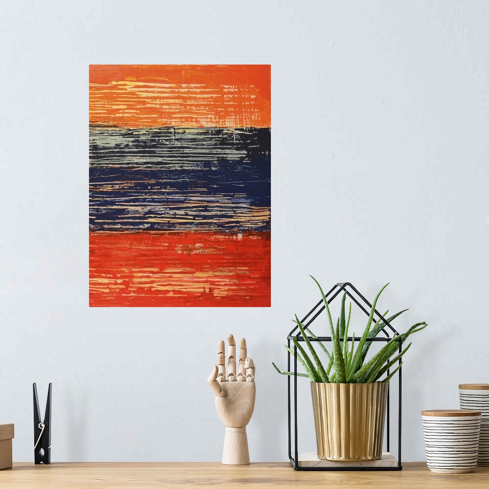 A bohemian room featuring Abstract art using orange, red and dark blue in a weathered and worn look.
