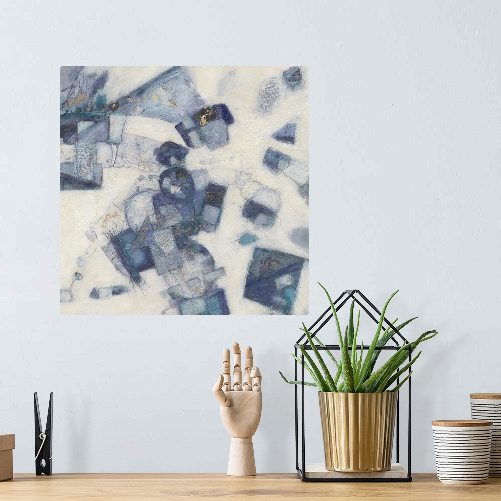 A bohemian room featuring Square abstract painting with shapes layered together in shades of blue on a white textured backg...
