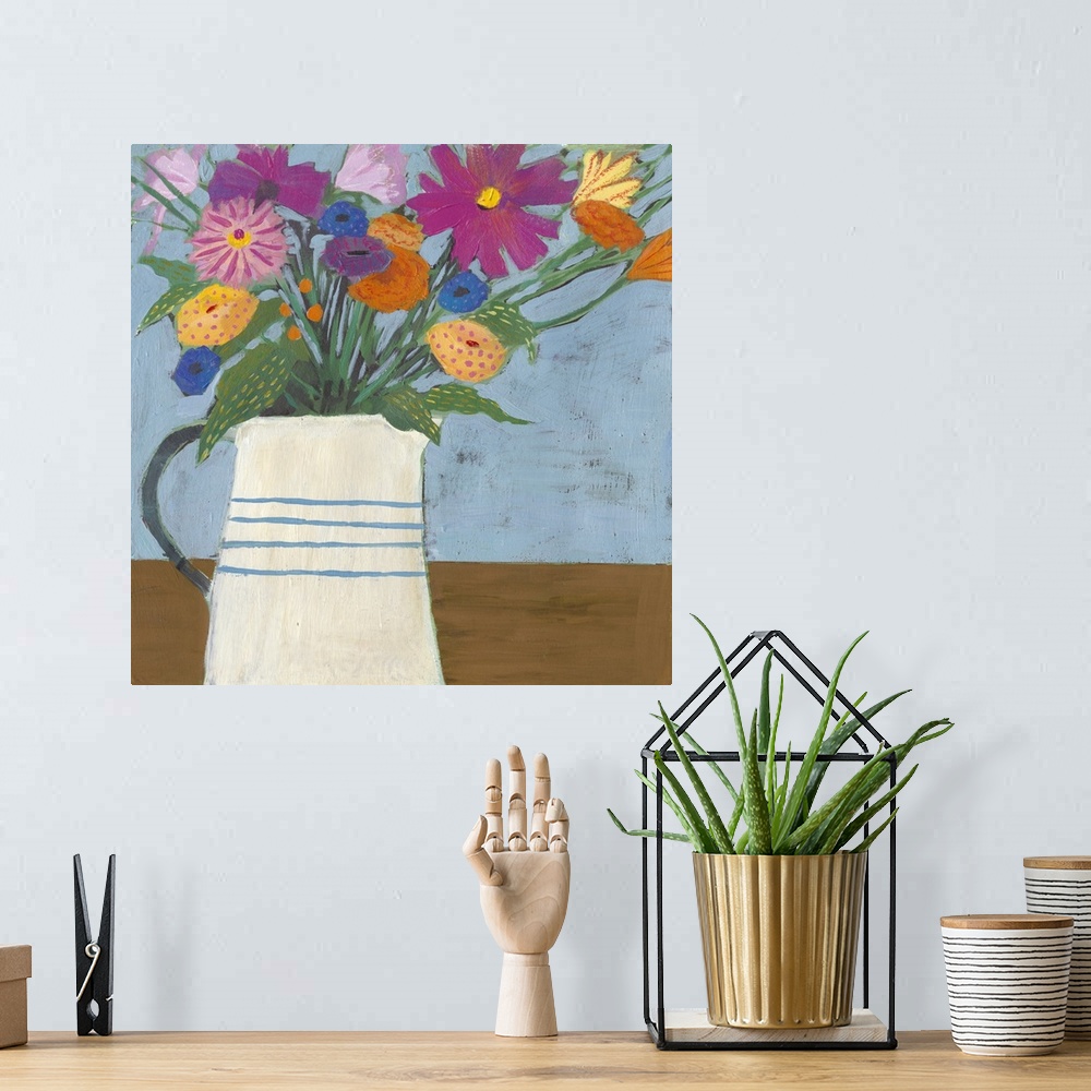 A bohemian room featuring Folk art painting of bouquet of flowers in a farmhouse pitcher.