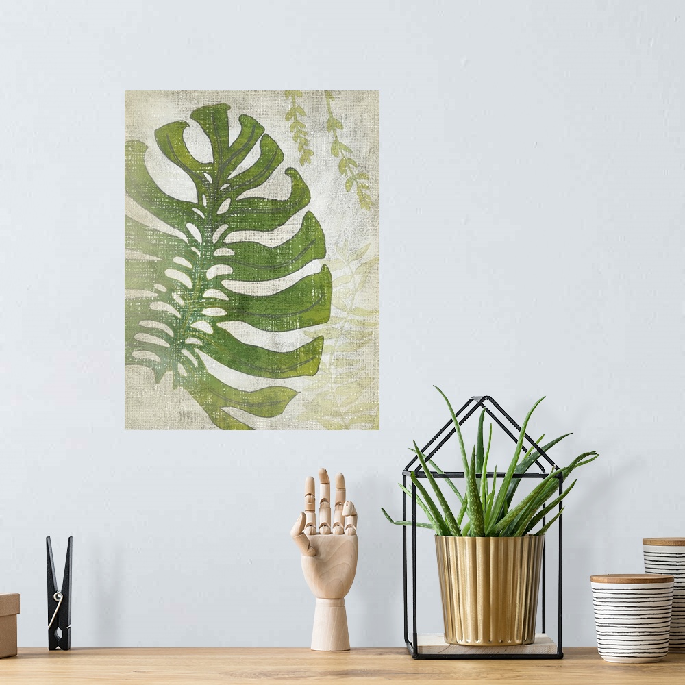 A bohemian room featuring Vertical decor with an illustrated palm leaf on a textured neutral colored background.