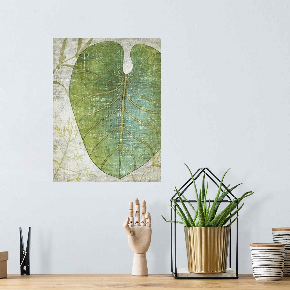 A bohemian room featuring Vertical decor with an illustrated tropical leaf on a textured neutral colored background.