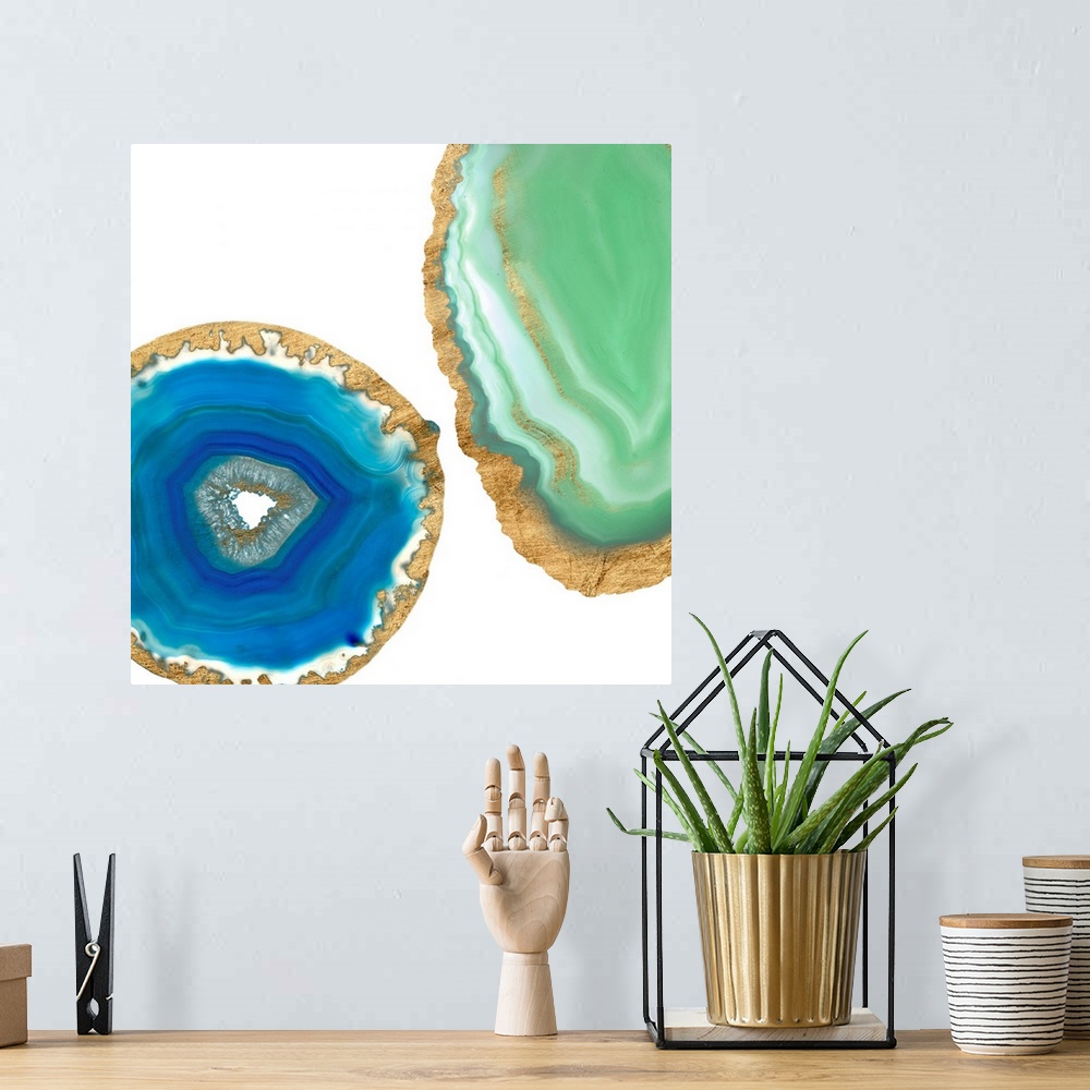 A bohemian room featuring Decorative square art with blue and green agate that has a metallic gold outline, on a white back...