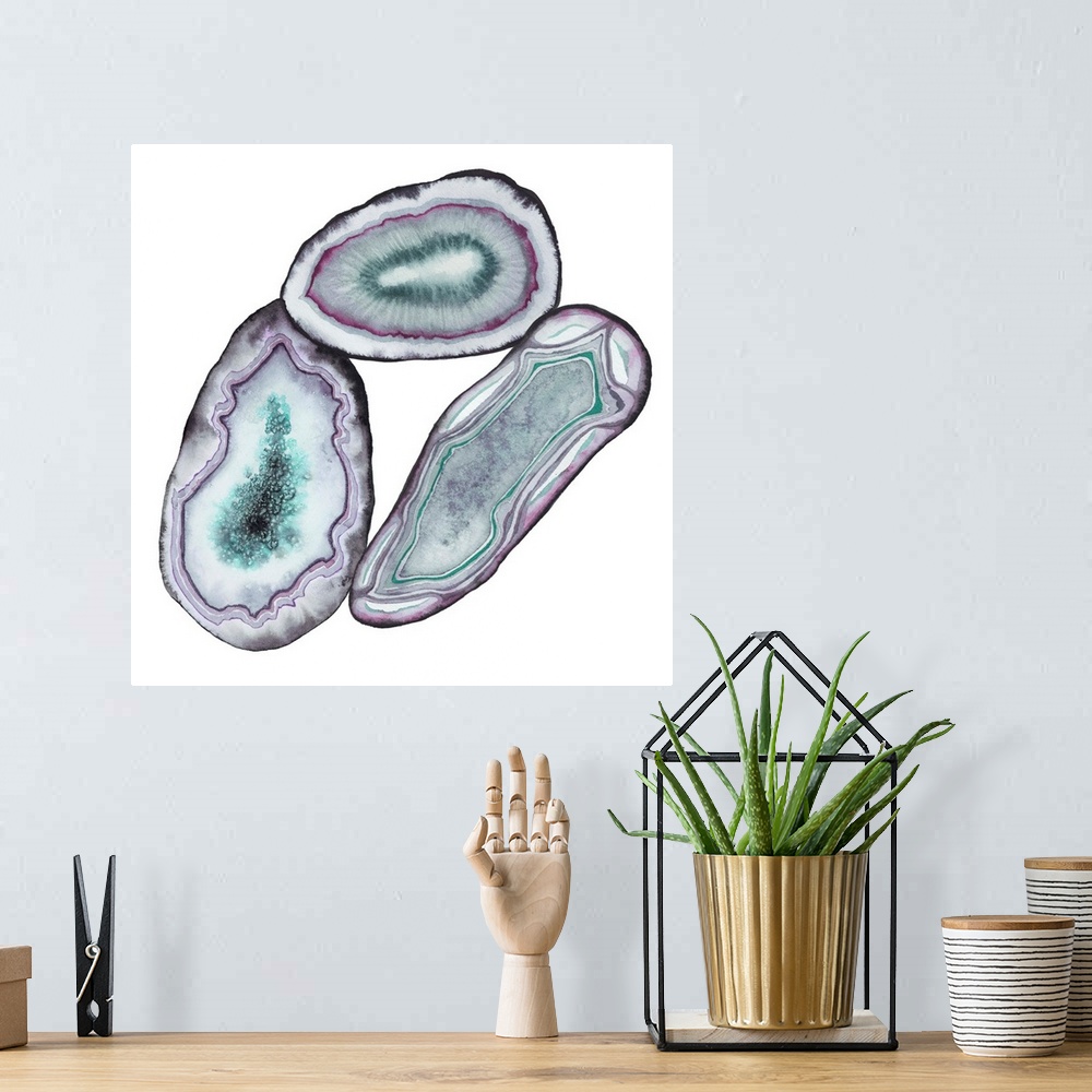 A bohemian room featuring Square watercolor artwork of geode rocks in green, purple and blue on a white background.