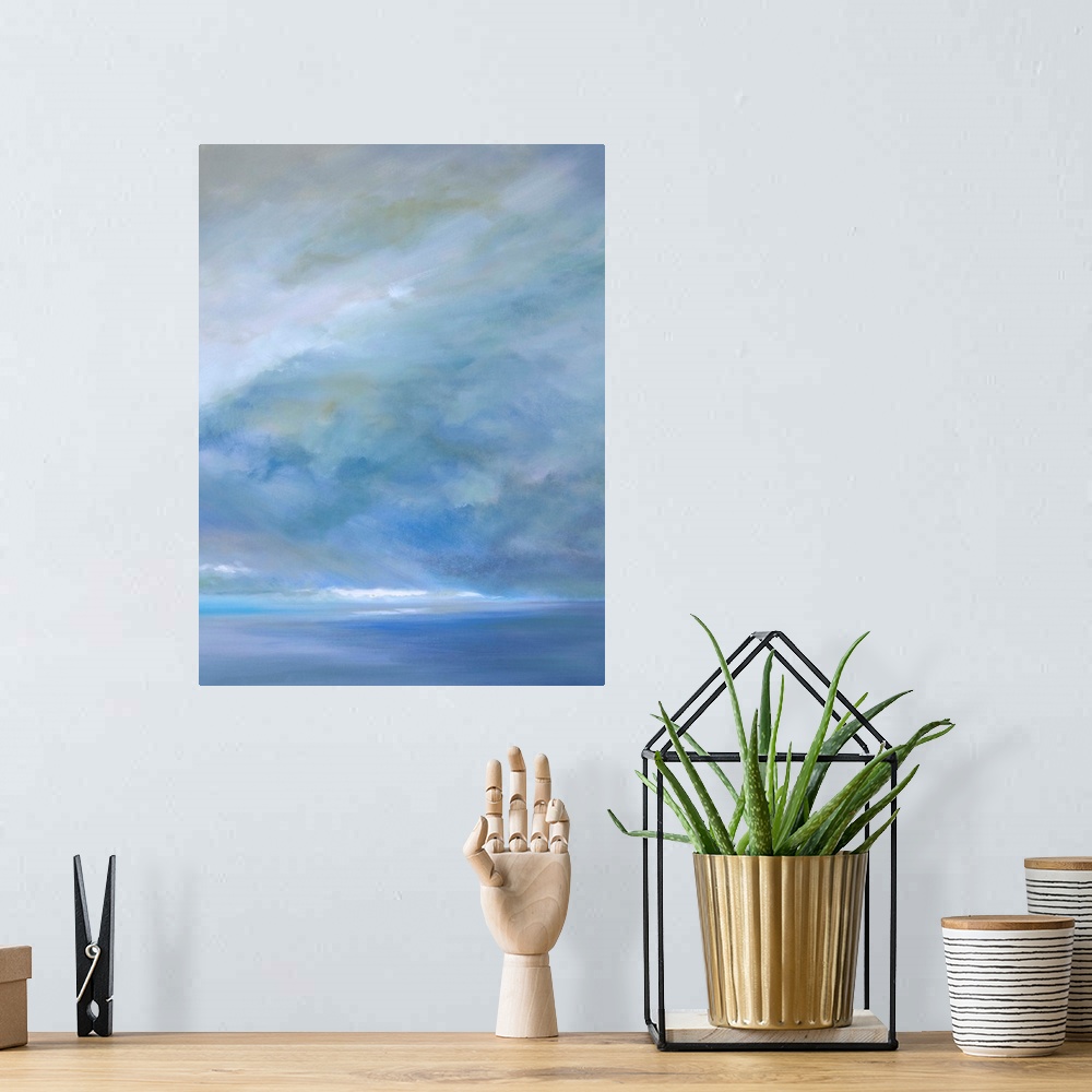 A bohemian room featuring Contemporary painting of a seascape with soft light streaming through the clouds.