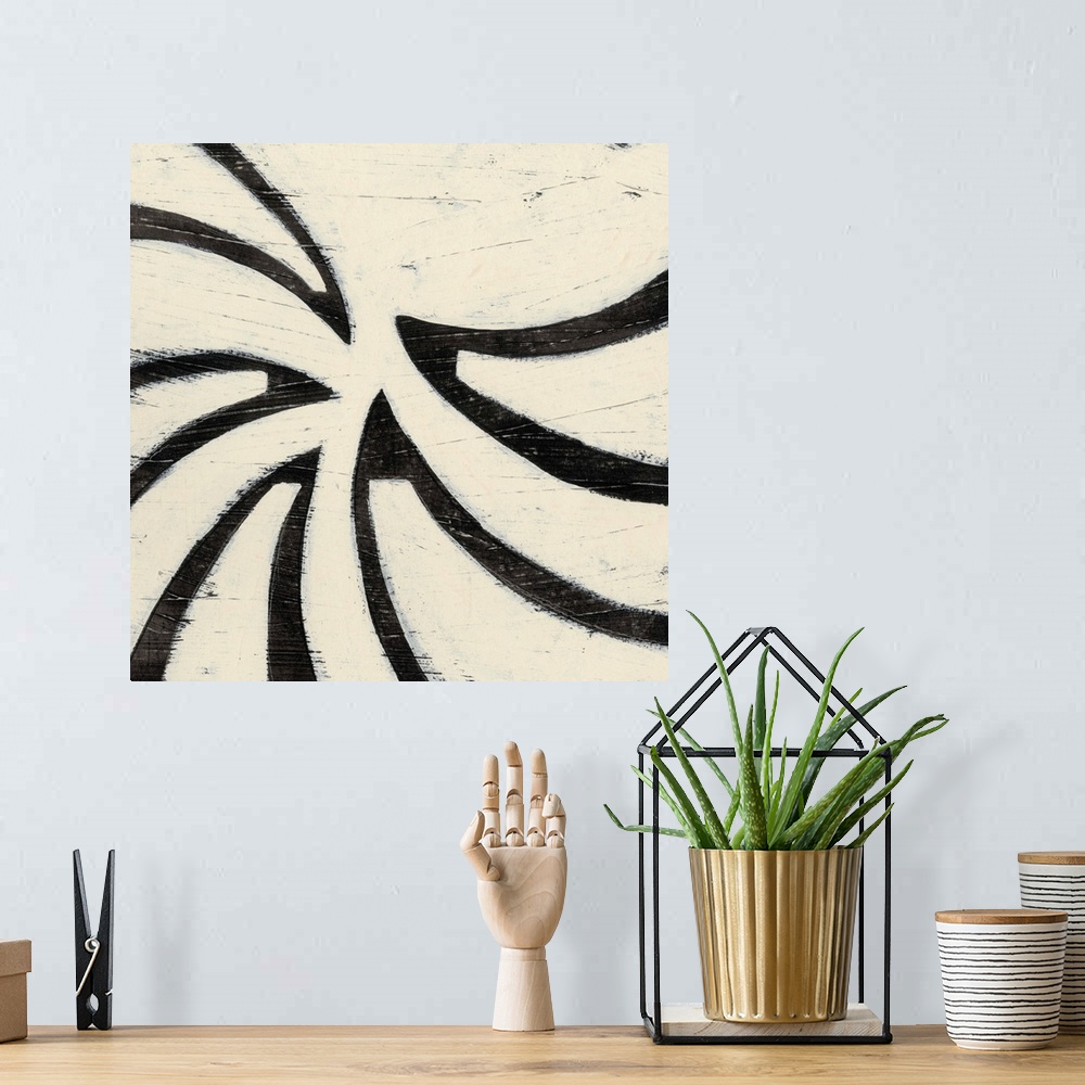A bohemian room featuring Black and white abstract artwork made of curved shapes.