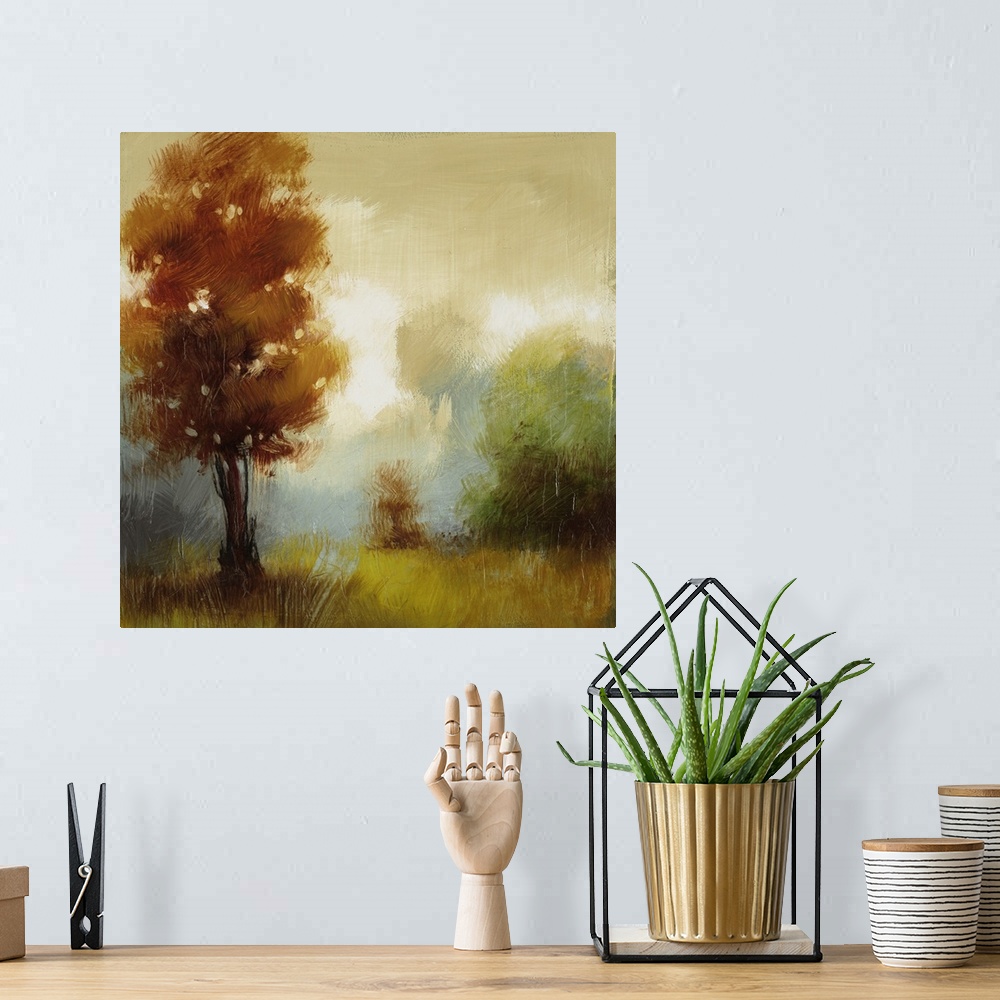 A bohemian room featuring Contemporary painting of several trees in fall colors in a foggy field.