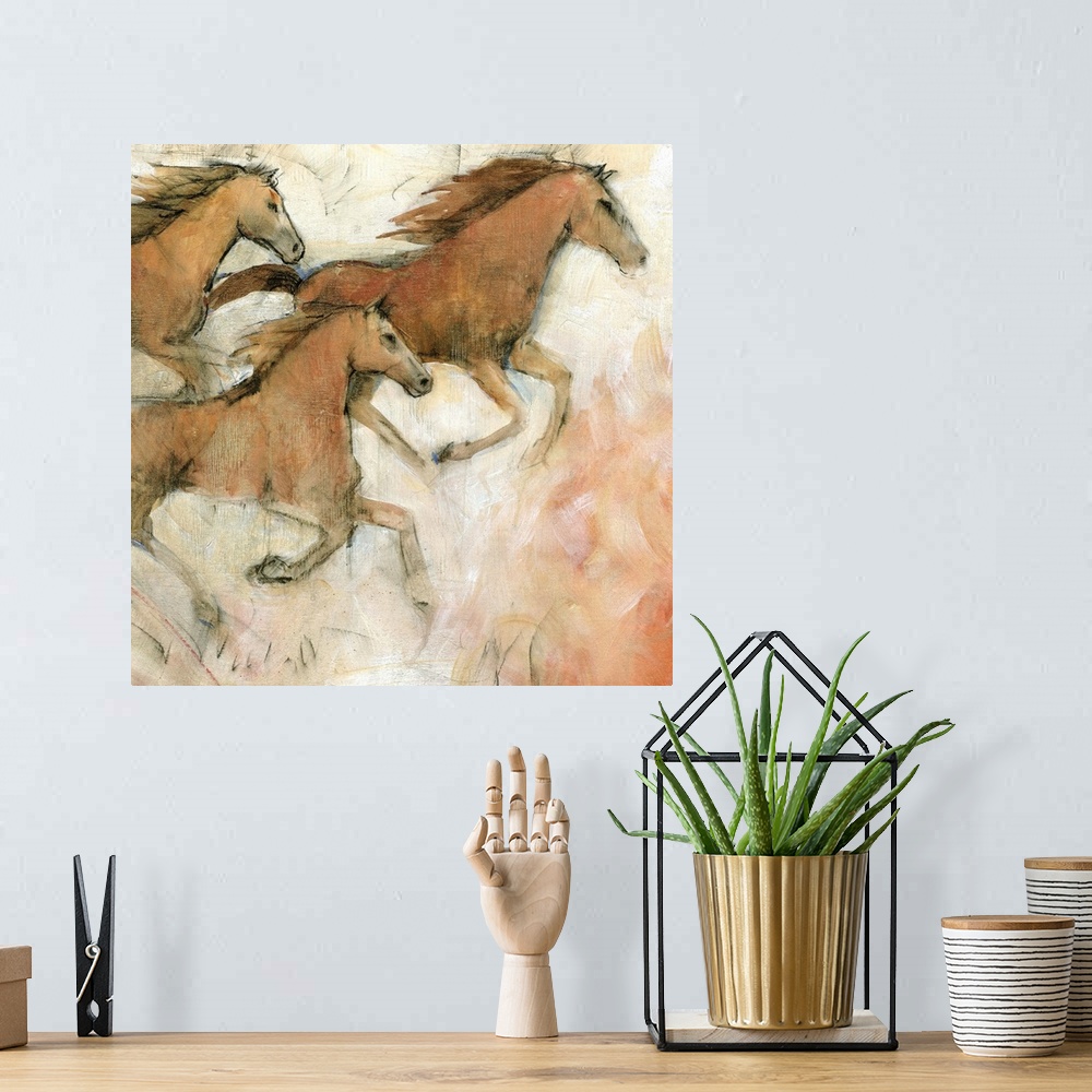 A bohemian room featuring Contemporary painting of galloping horses.