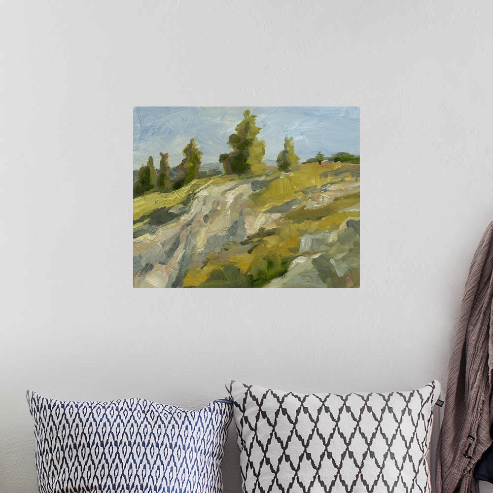 A bohemian room featuring Contemporary painting of boulders on hillside under a blue sky.