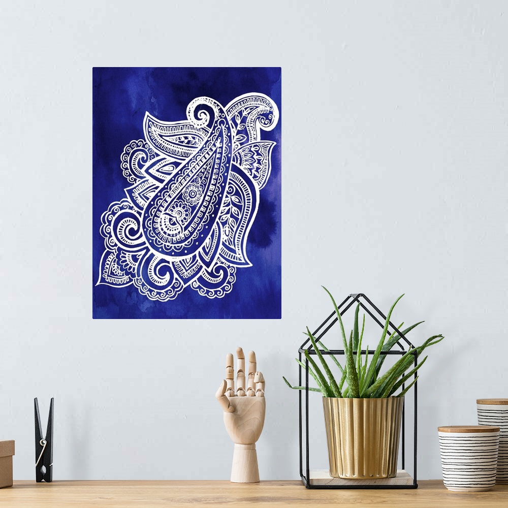 A bohemian room featuring Artistic design of a large paisley pattern in white on an indigo blue backdrop.