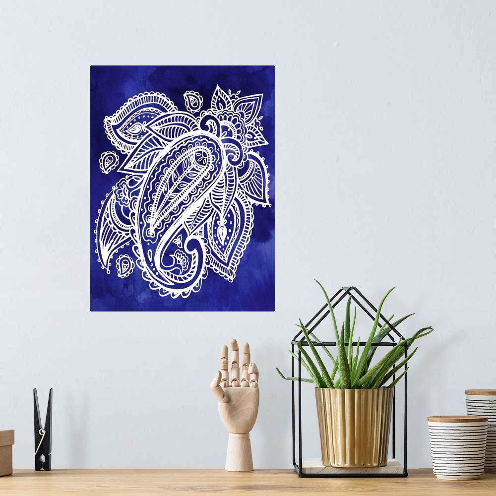 A bohemian room featuring Artistic design of a large paisley pattern in white on an indigo blue backdrop.