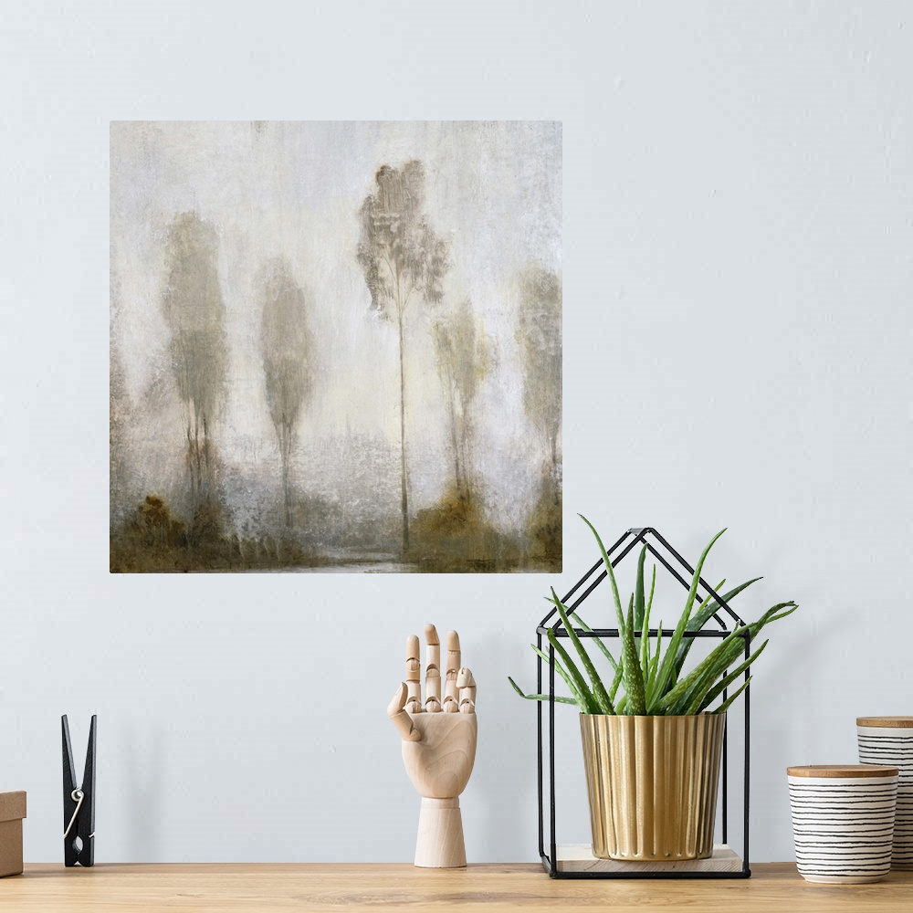 A bohemian room featuring A contemporary painting of a fog shrouded group of tall thin trees.
