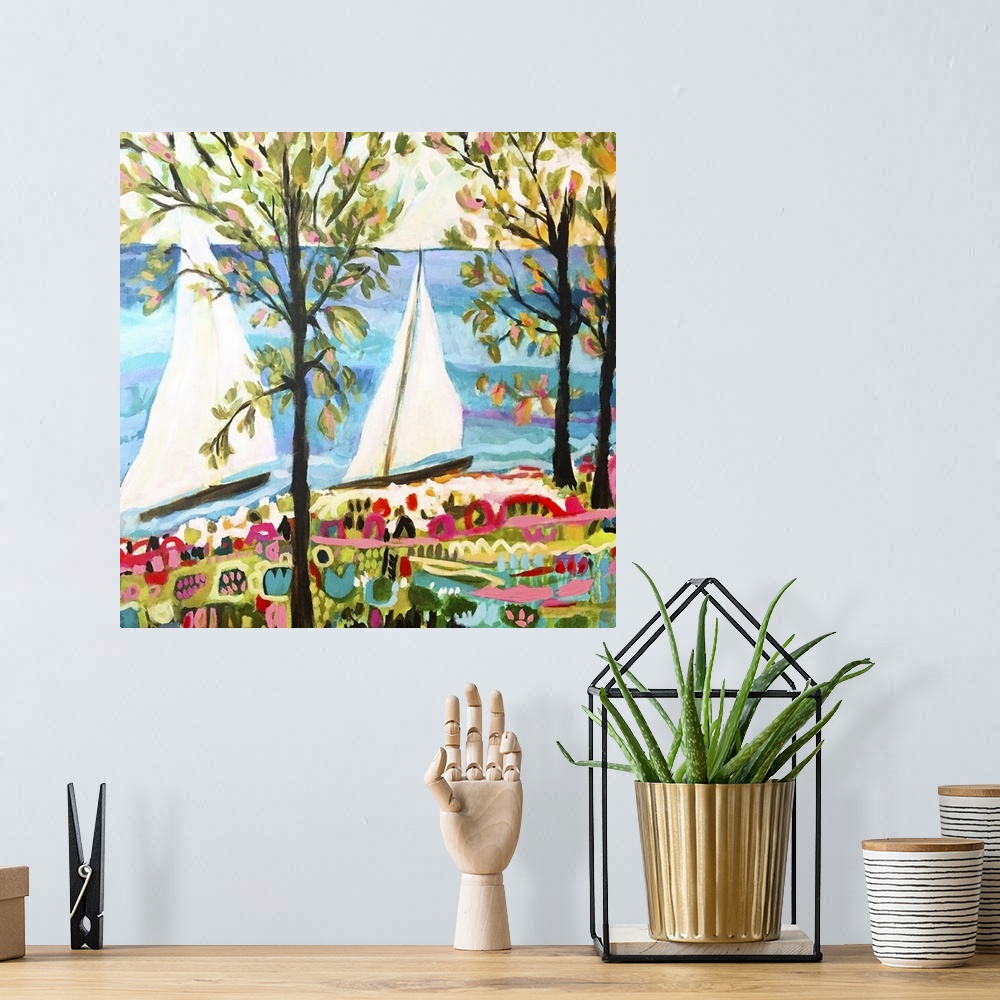 A bohemian room featuring Contemporary artwork of two sailboats on the ocean, seen through the trees.
