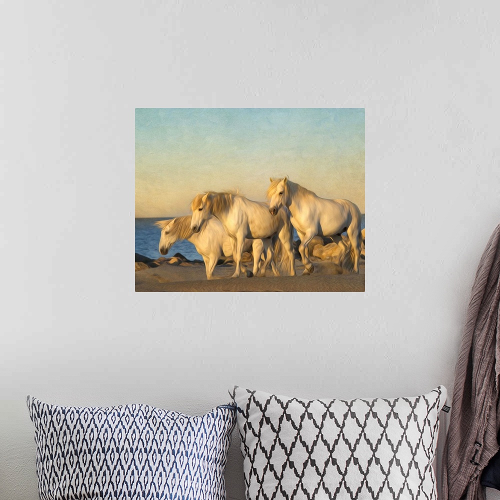 A bohemian room featuring Photograph of a group of white horses grazing on a beach.