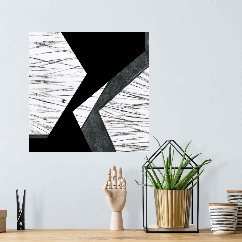 A bohemian room featuring Black and white geometric abstract painting on a square background.