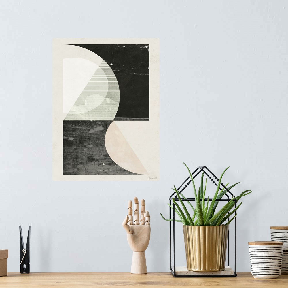 A bohemian room featuring Minimalist geometric artwork in black and pale pink of a stylized city street.