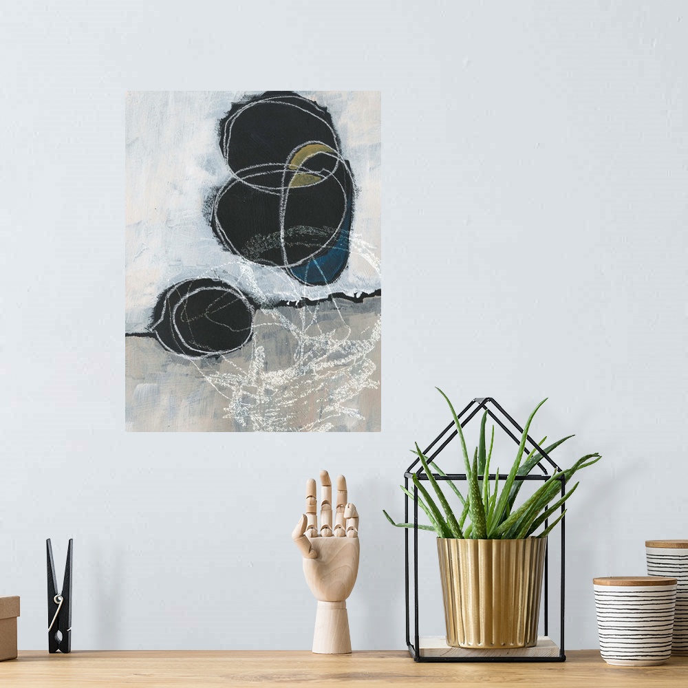 A bohemian room featuring Abstract artwork featuring vertical and horizontal white brush strokes revealing black circular s...