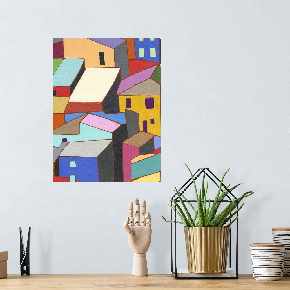 A bohemian room featuring Painting of colorful buildings and rooftops.