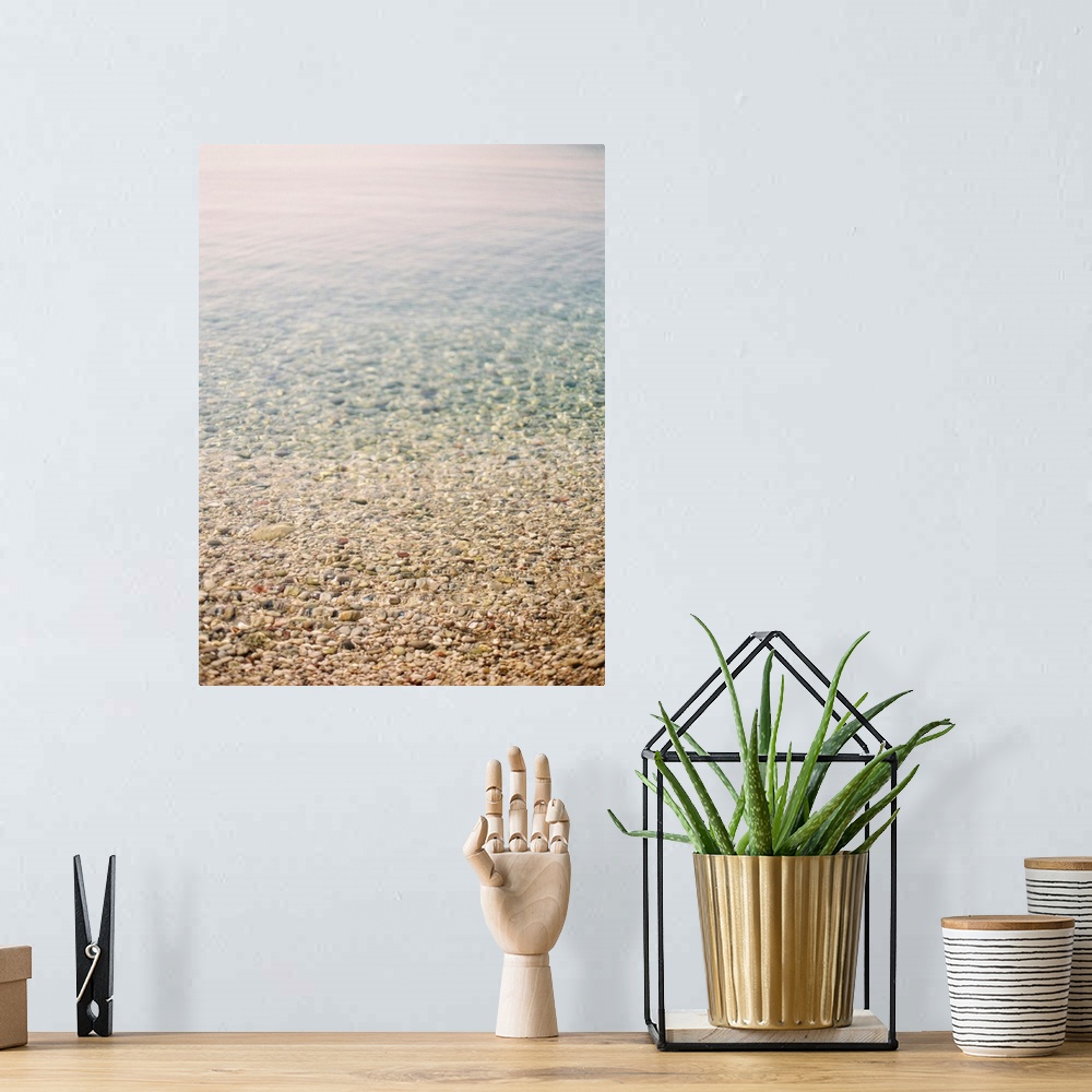 A bohemian room featuring Photograph of shallow ocean water on a pebble beach, Corfu, Greece.