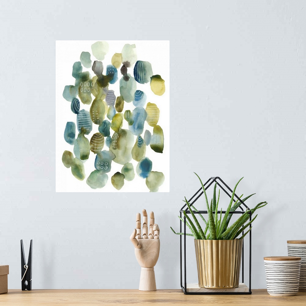 A bohemian room featuring This contemporary artwork contains blue and green pebbles of color with some that are decorated w...