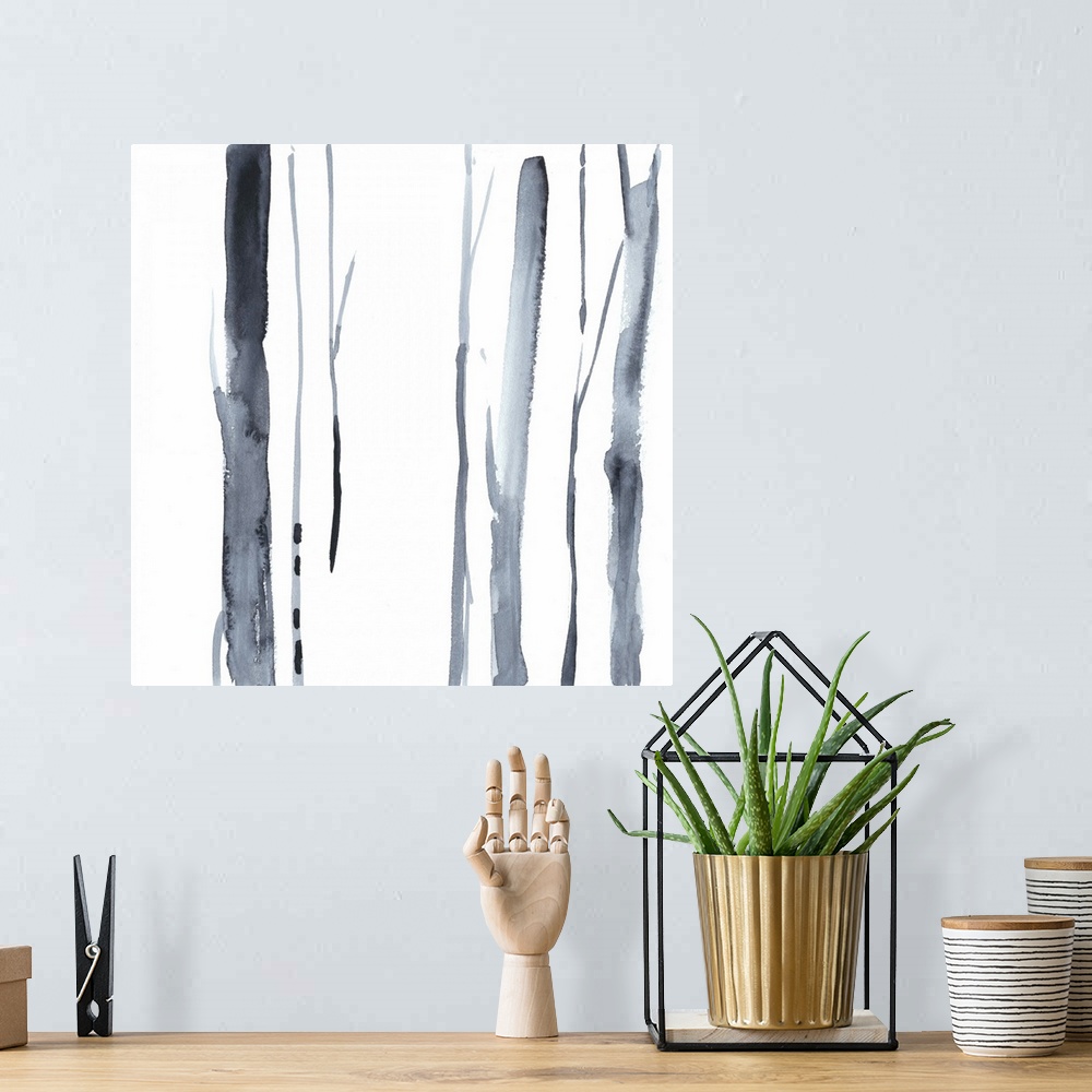 A bohemian room featuring Square watercolor painting of abstract tree trunks in gray against a white background.