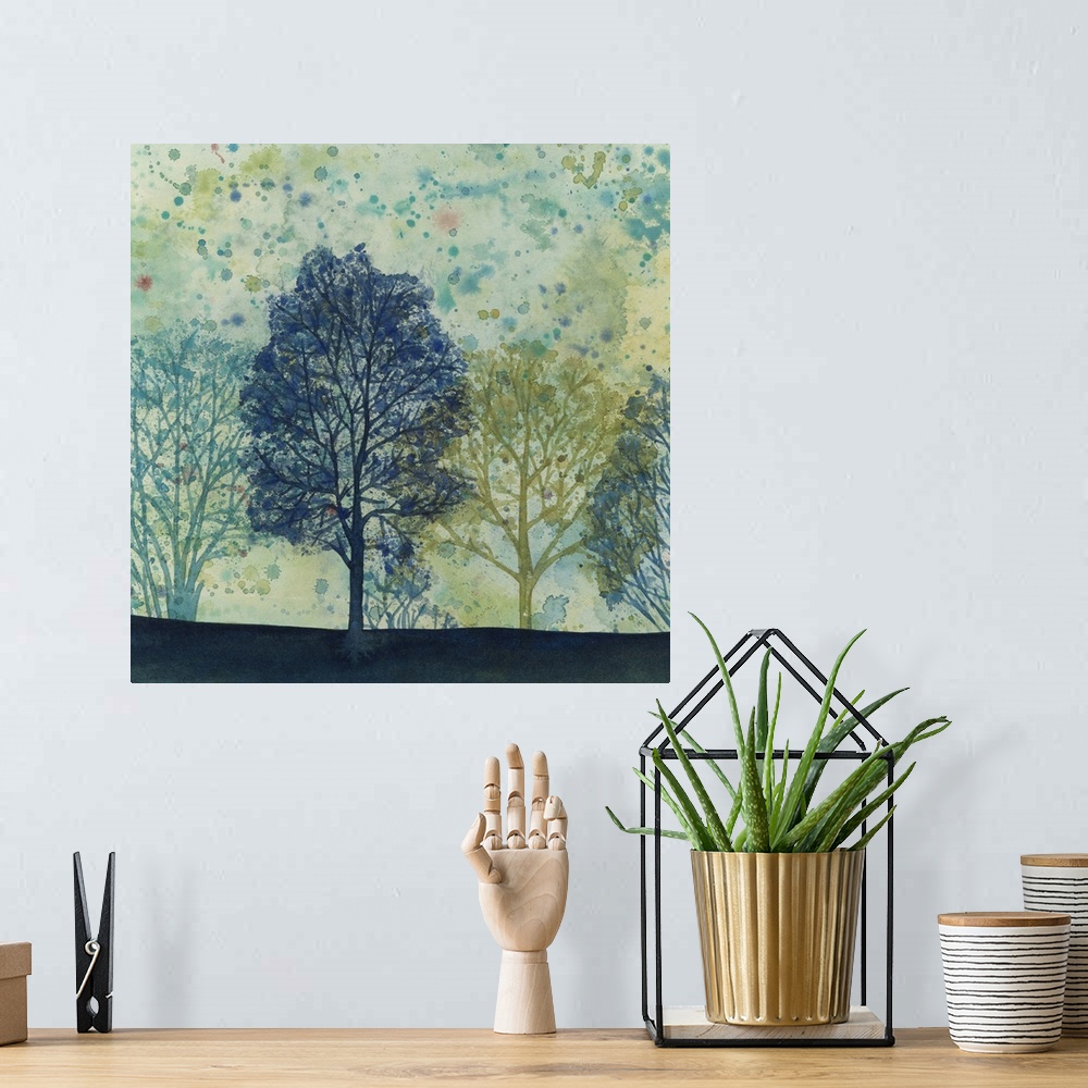 A bohemian room featuring Watercolor painting of silhouetted trees in cool tones against a green and speckled sky.