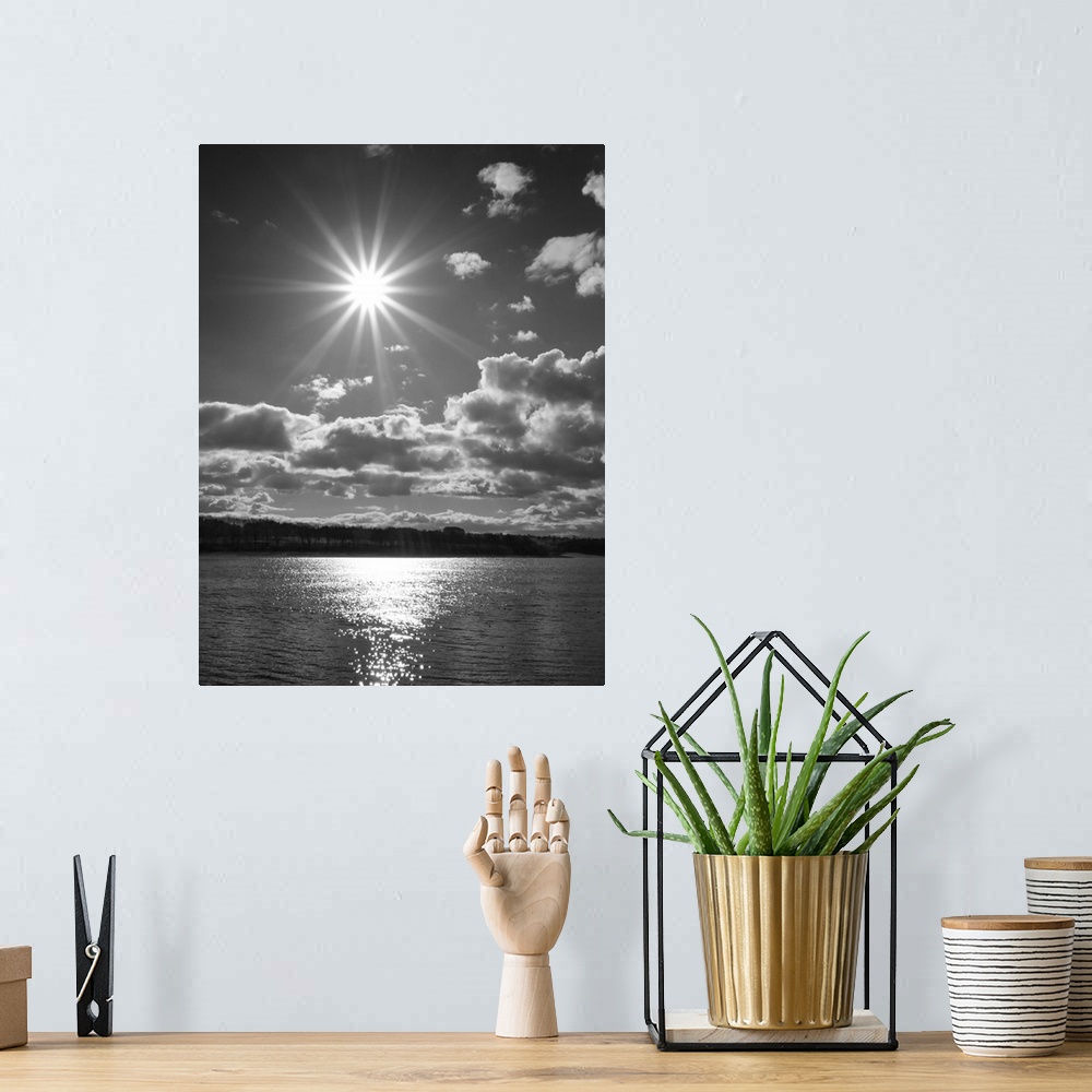 A bohemian room featuring Fine art photo of the bright sun shining over the sea.