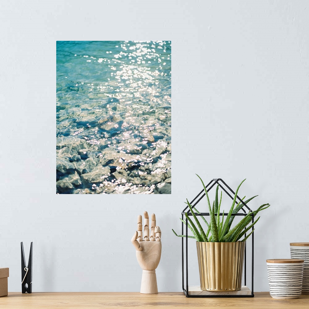 A bohemian room featuring Photograph of sunlight reflecting off of clear blue water, Canmore, Canada.