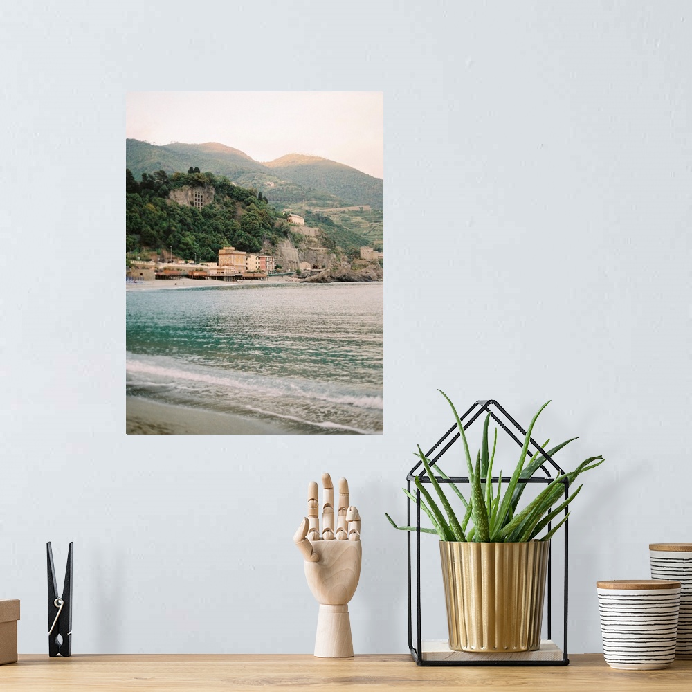 A bohemian room featuring Photograph of the water in front of a sunlit town, Cinque Terre, Italy.