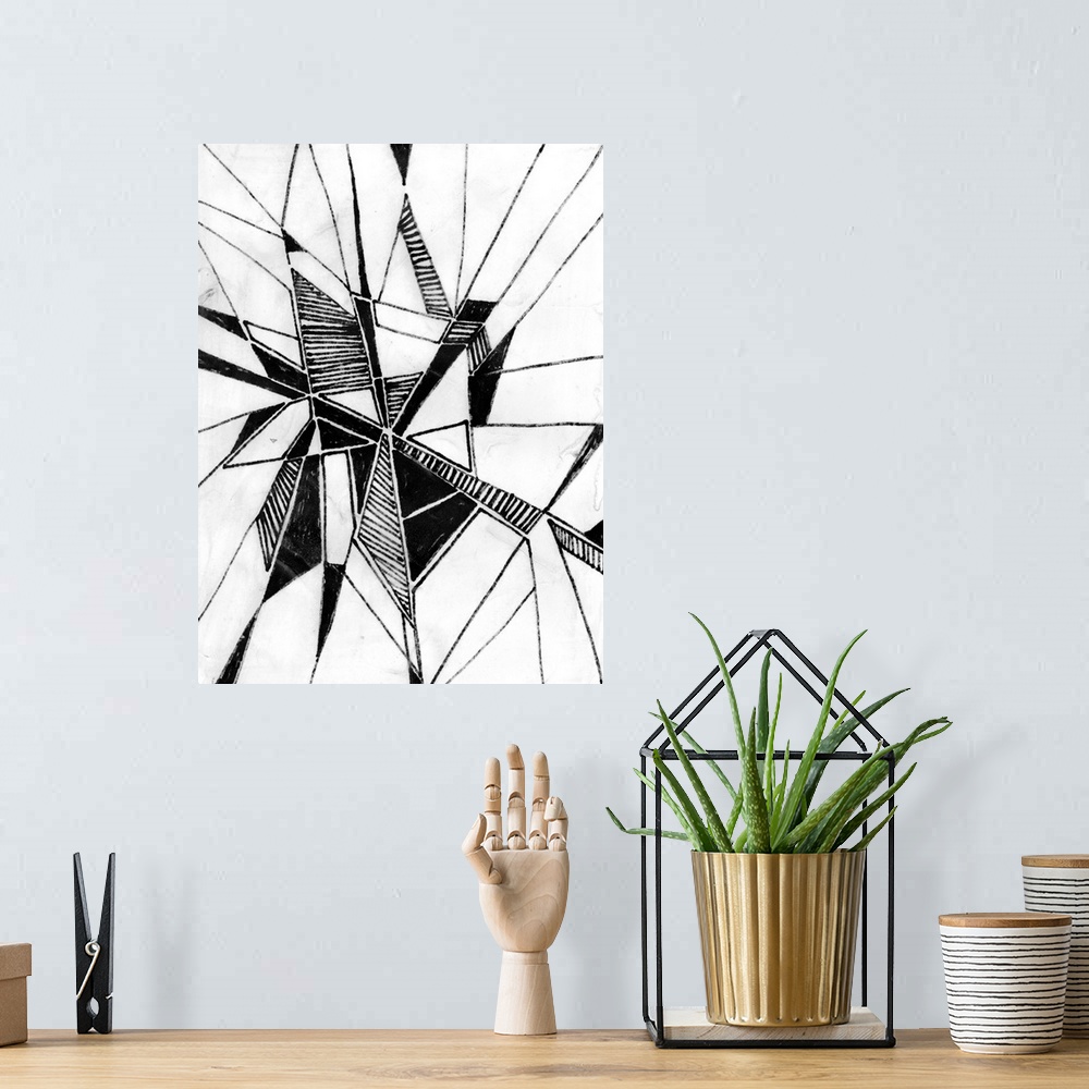A bohemian room featuring Black and white drawing of triangular patterned shapes.