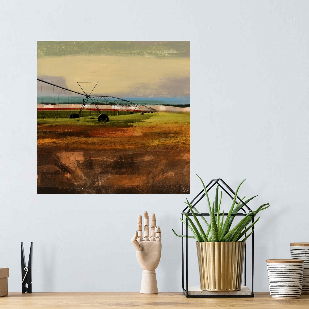 A bohemian room featuring Abstract artwork of farming watering device against a multi-layered and colored surrounding.