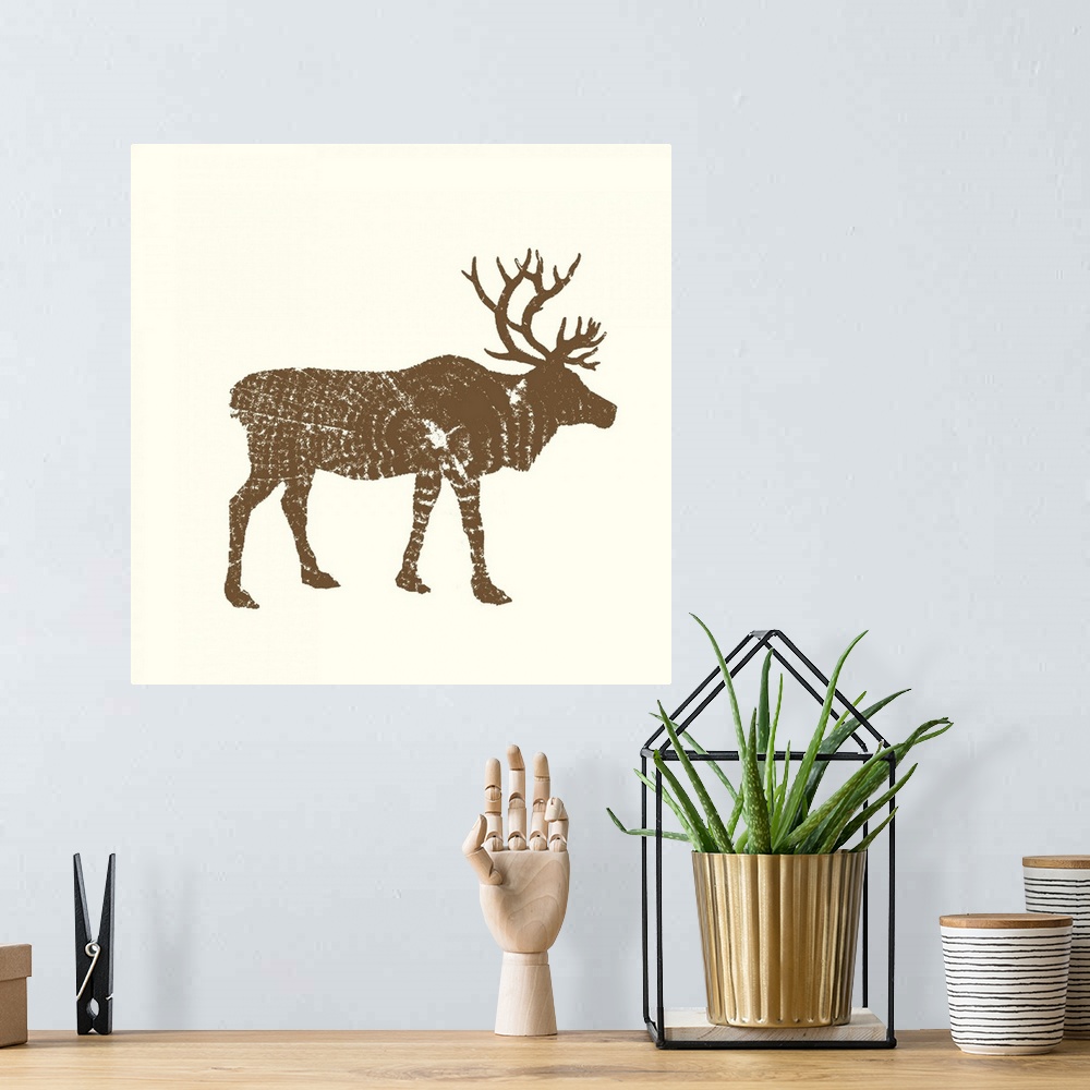 A bohemian room featuring Contemporary cabin decor artwork of a woodland animal silhouettes made up of stamp cross section ...