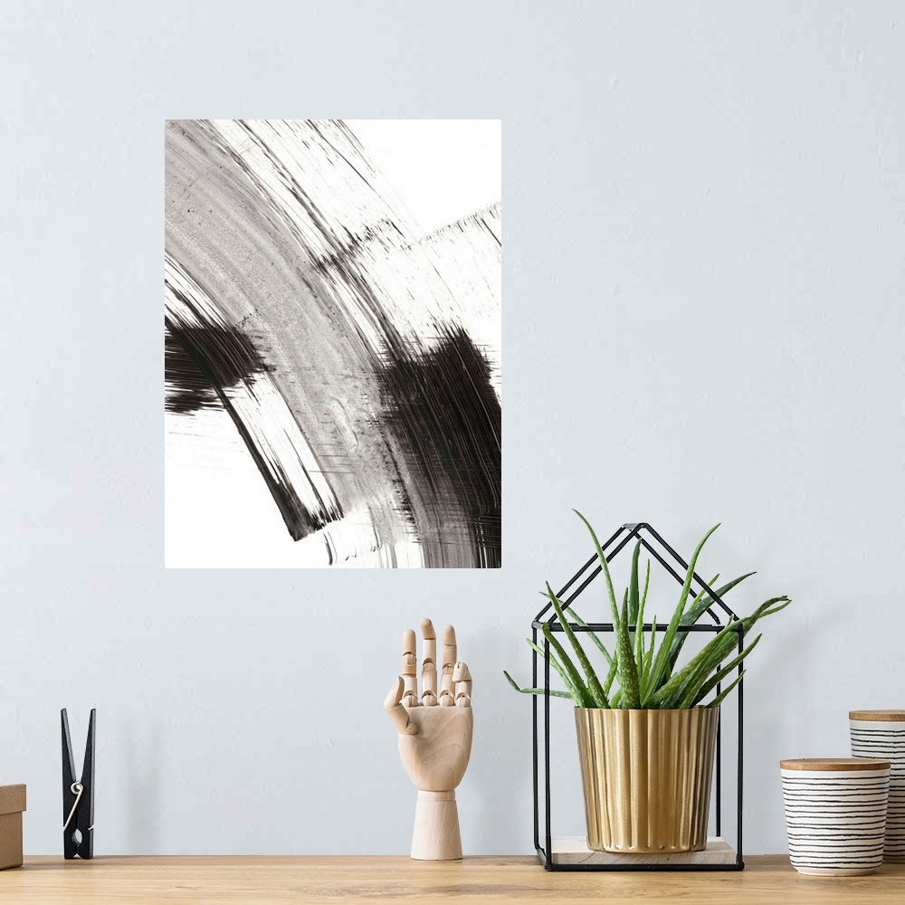 A bohemian room featuring Contemporary abstract painting of black and gray brushstrokes on a white background.