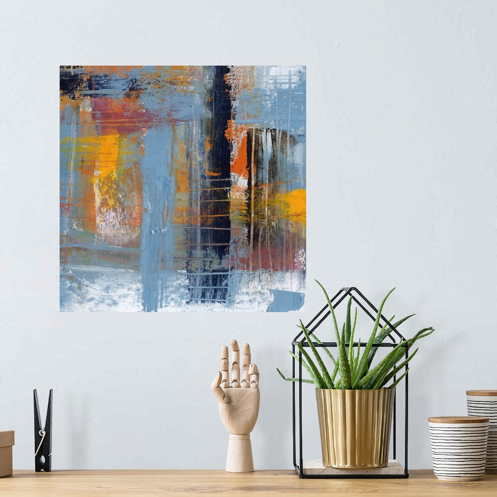 A bohemian room featuring Colorful contemporary abstract painting using muted blue orange and yellow tones.