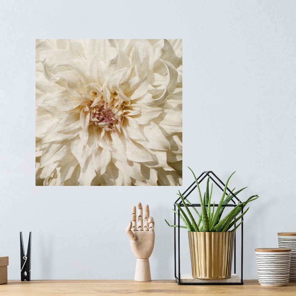 A bohemian room featuring Flowers in shades of white and yellow fill this decorative art edge to edge.