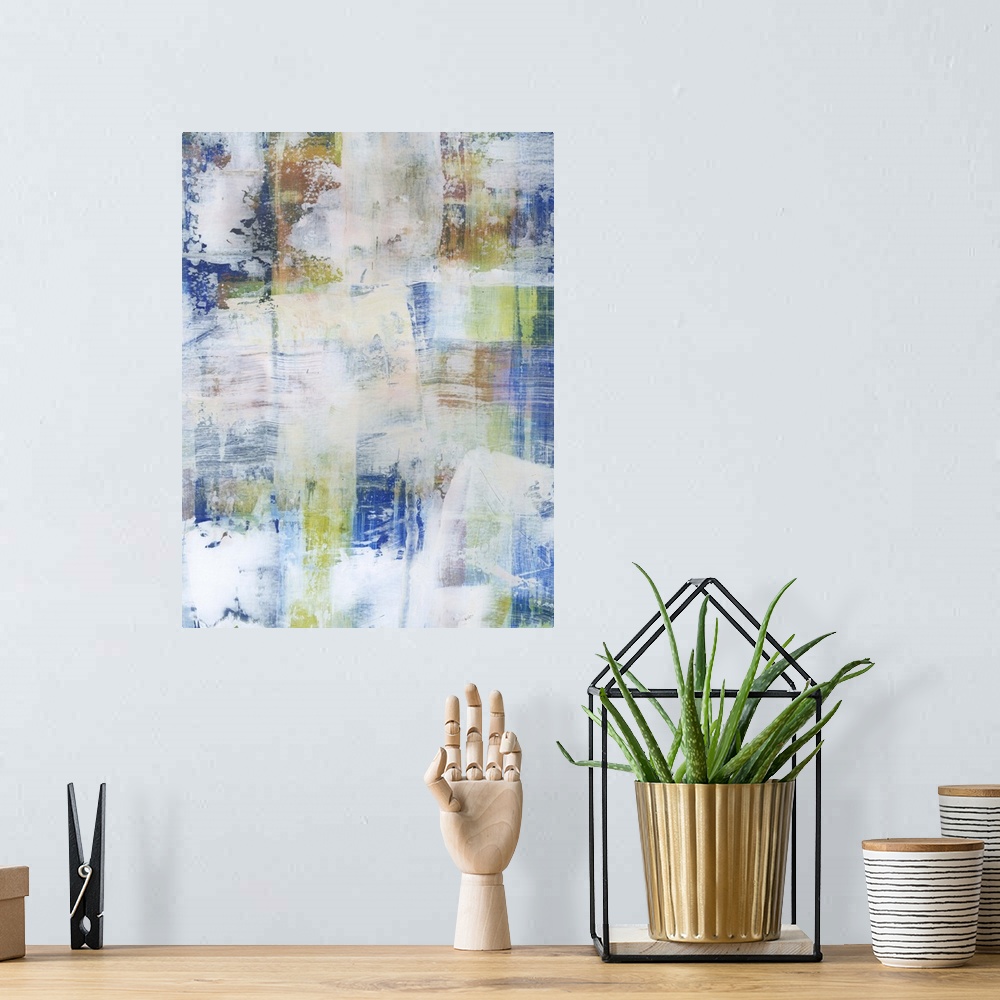 A bohemian room featuring Contemporary abstract painting using blue tones with faded white in swiping motions.