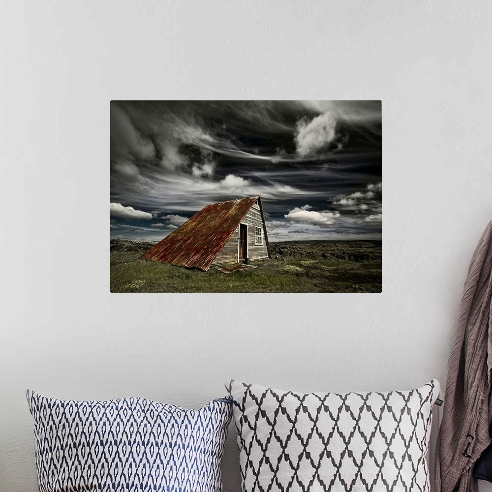 A bohemian room featuring An abandoned shack in Iceland under a blanket of wispy clouds.