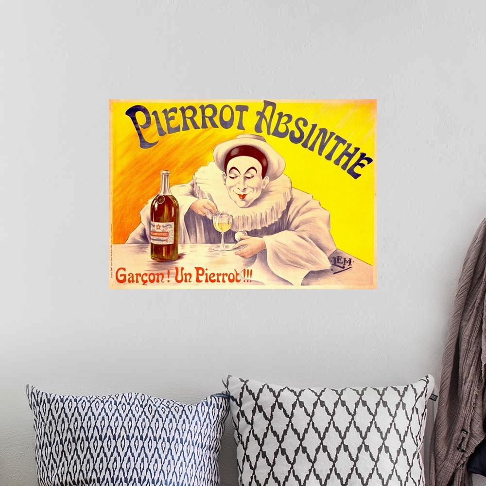 A bohemian room featuring Advertising poster for an alcoholic beverage, featuring a French clown in heavy white makeup and ...