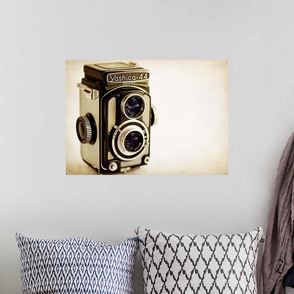 A bohemian room featuring Photograph of a vintage camera with a vintage sepia look to it.