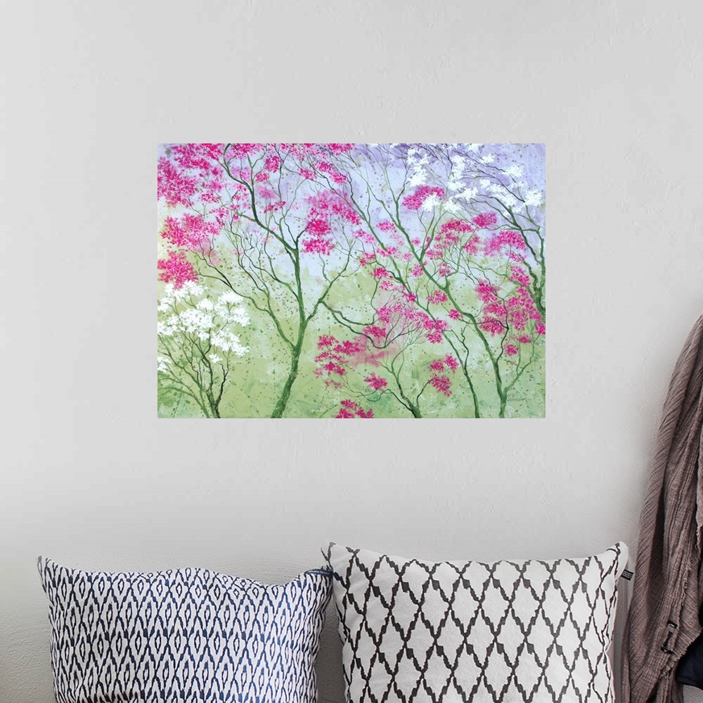A bohemian room featuring Colorful painting of tree tops with pink, purple, and white blossoms on a green background.