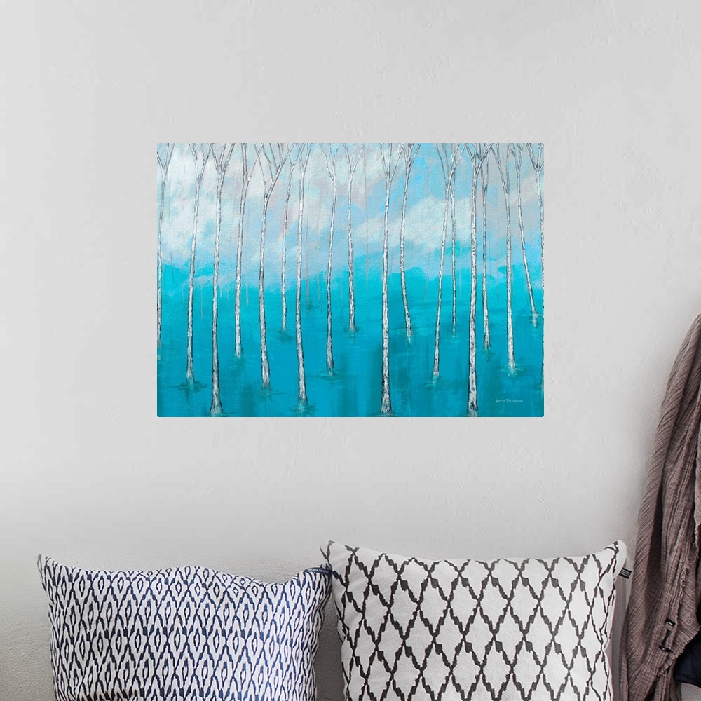 A bohemian room featuring Landscape painting of bare trees in marsh waters with a cloudy background.
